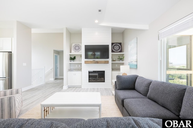 2267 Sandpiper Rd Lot 29, Corolla, NC 27927 - living area with light wood-style floors, a fireplace, and baseboards