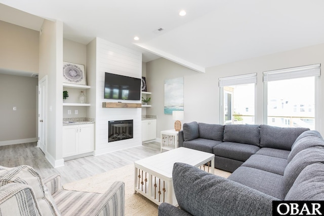 2267 Sandpiper Rd Lot 29, Corolla, NC 27927 - living area featuring a large fireplace, light wood-style flooring, baseboards, and recessed lighting