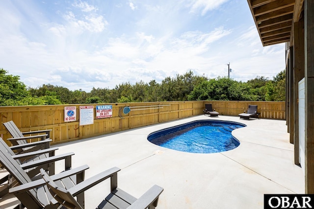 2267 Sandpiper Rd Lot 29, Corolla, NC 27927 - view of pool with a fenced backyard and a patio area