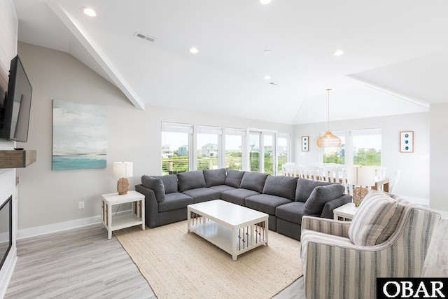 2267 Sandpiper Rd Lot 29, Corolla, NC 27927 - living room featuring lofted ceiling, light wood finished floors, baseboards, and recessed lighting