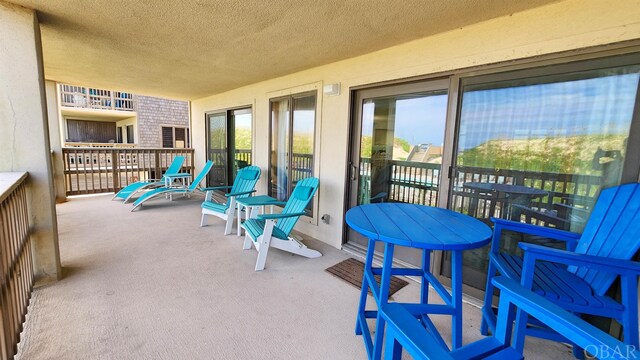 balcony featuring a sunroom