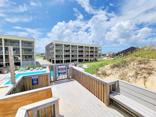 deck featuring a community pool