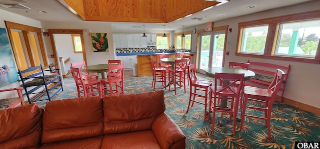 dining room with recessed lighting, visible vents, baseboards, french doors, and a tray ceiling