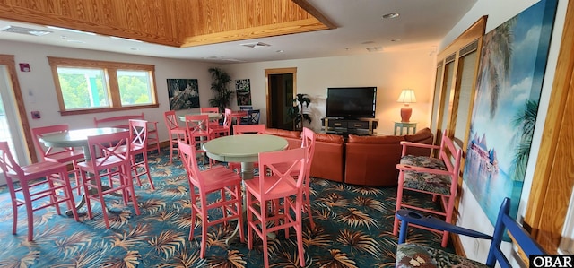 dining area featuring visible vents and carpet flooring