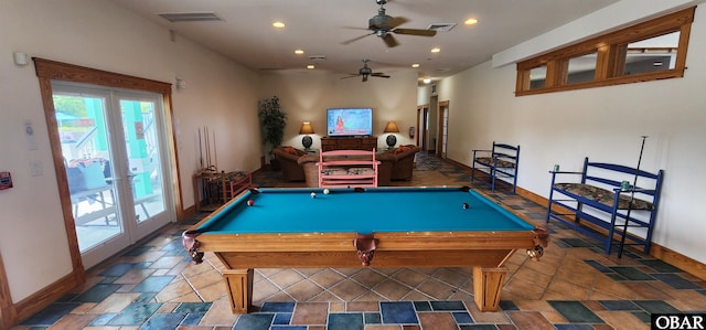 recreation room with recessed lighting, stone tile flooring, visible vents, and french doors