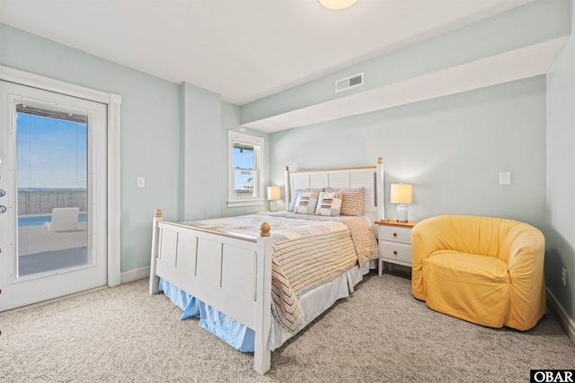 5006 S Links Dr Lot 6, Nags Head, NC 27959 - carpeted bedroom with baseboards, visible vents, and access to exterior