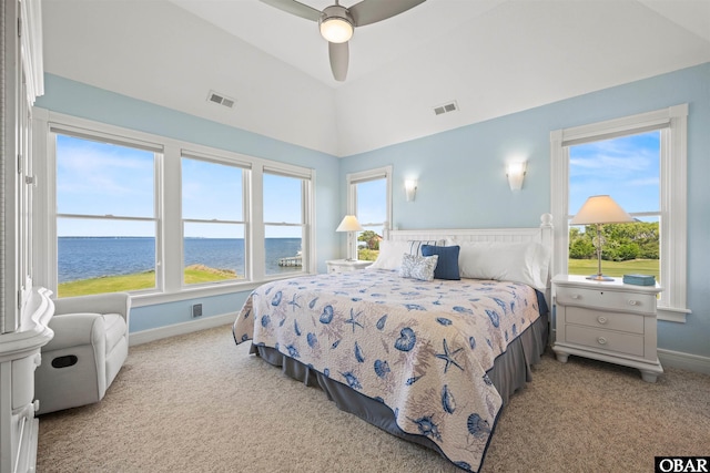 5006 S Links Dr Lot 6, Nags Head, NC 27959 - carpeted bedroom with baseboards, visible vents, a water view, and lofted ceiling