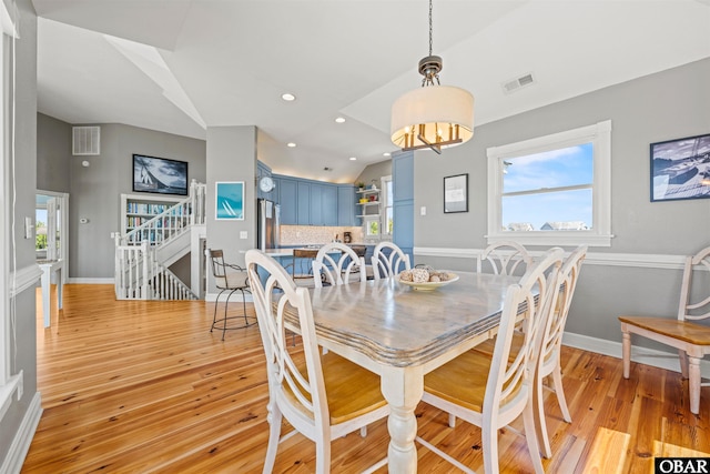 5006 S Links Dr Lot 6, Nags Head, NC 27959 - dining area with an inviting chandelier, visible vents, light wood-type flooring, and vaulted ceiling