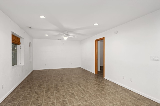 empty room featuring a ceiling fan, recessed lighting, visible vents, and baseboards