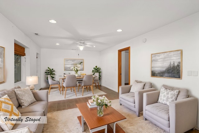 living area with baseboards, a ceiling fan, and recessed lighting