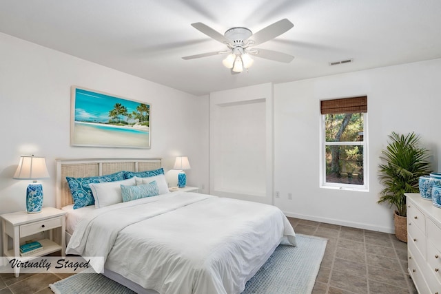 bedroom featuring baseboards, visible vents, and a ceiling fan