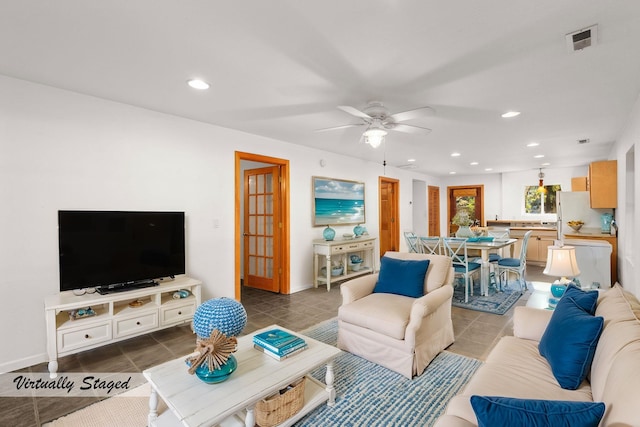 tiled living room with ceiling fan, visible vents, and recessed lighting