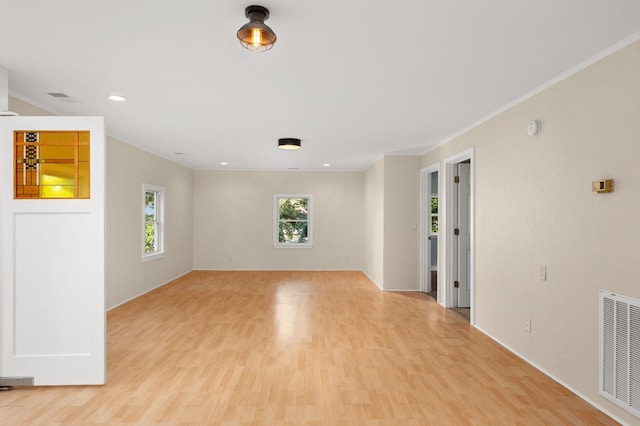 spare room with light wood-type flooring, visible vents, and recessed lighting