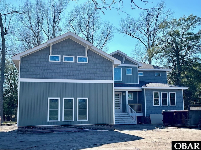 view of front facade with a shingled roof