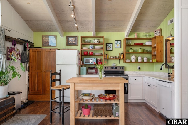 kitchen with white appliances, dark wood-type flooring, a sink, white cabinets, and light countertops