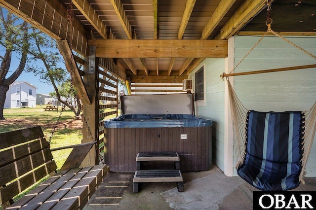 view of patio / terrace with a hot tub