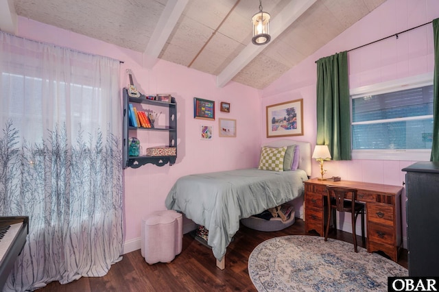 bedroom with lofted ceiling with beams and dark wood finished floors