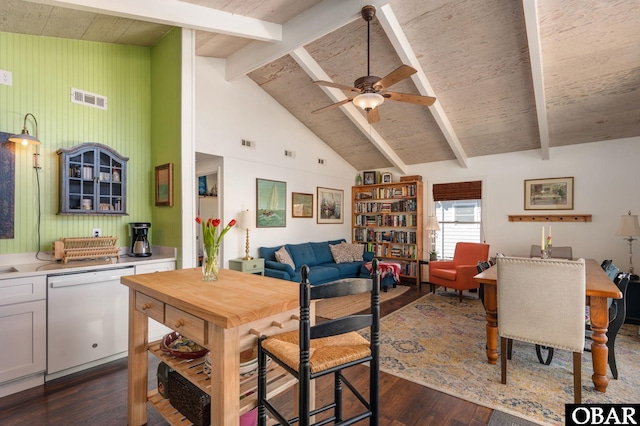 interior space featuring dark wood finished floors, beamed ceiling, light countertops, visible vents, and dishwasher