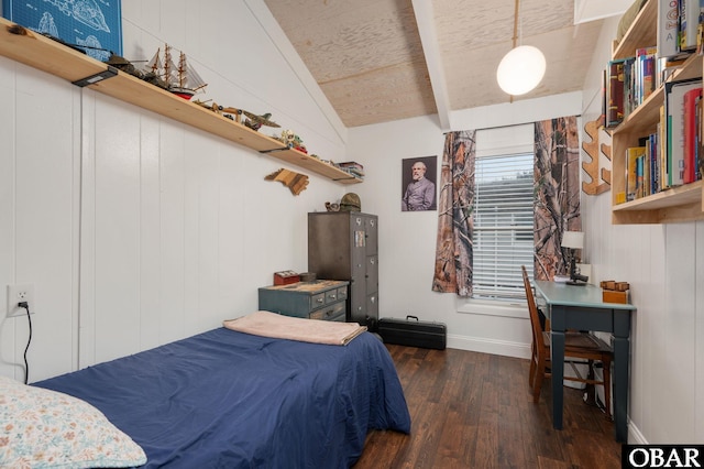 bedroom featuring dark wood-style flooring, vaulted ceiling with beams, and baseboards