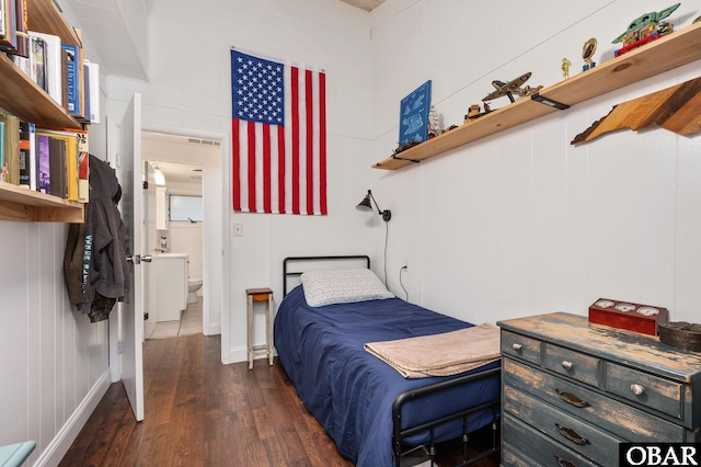 bedroom featuring dark wood-type flooring