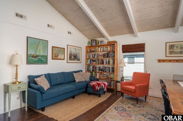 living area featuring lofted ceiling with beams, visible vents, and dark wood finished floors