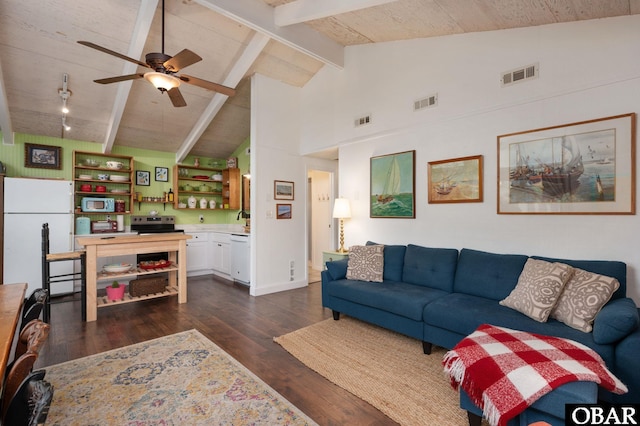 living room with dark wood finished floors, visible vents, and vaulted ceiling with beams