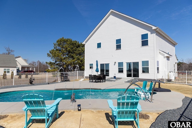 view of pool with a fenced in pool, a patio, and fence