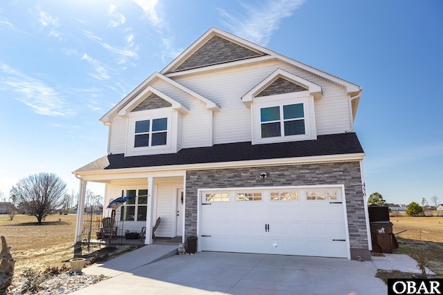 view of front of house with covered porch, a garage, driveway, and roof with shingles