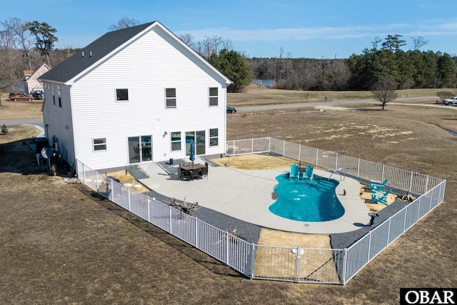 view of pool featuring a fenced in pool, a yard, a fenced backyard, and a patio area