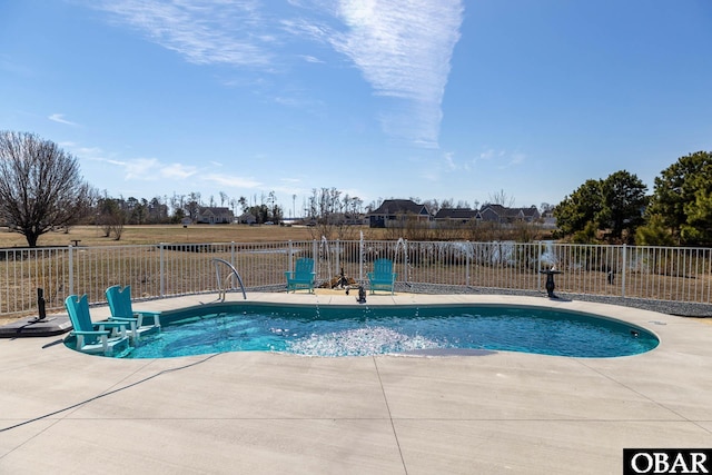 view of swimming pool featuring a patio area, a fenced in pool, and fence