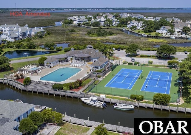 aerial view featuring a residential view and a water view