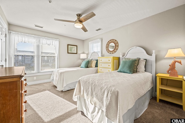 bedroom featuring a ceiling fan, carpet, visible vents, and baseboards