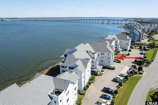 bird's eye view with a residential view and a water view