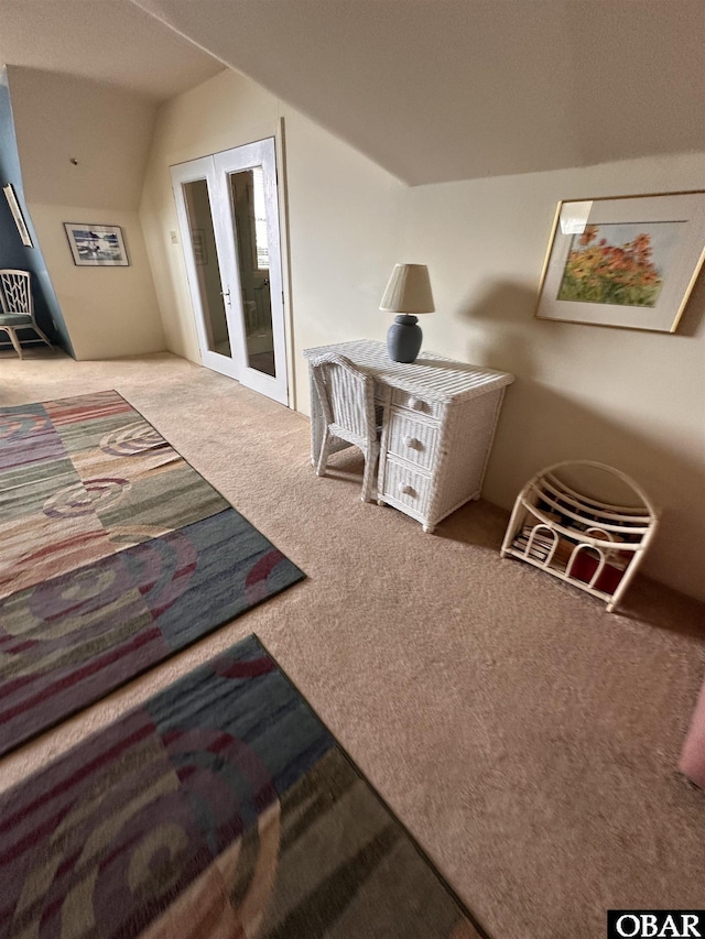 180 Irvin Garrish Hwy Unit 602, Ocracoke, NC 27960 - carpeted bedroom with french doors and lofted ceiling