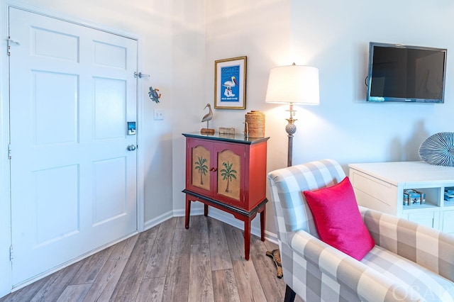 entryway featuring light wood-style floors and baseboards