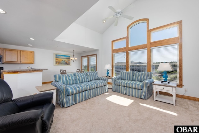1700 Paget Rd Unit C 3, Kill Devil Hills, NC 27948 - carpeted living area featuring a chandelier, recessed lighting, baseboards, ceiling fan, and a towering ceiling