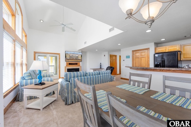 1700 Paget Rd Unit C 3, Kill Devil Hills, NC 27948 - dining space with baseboards, recessed lighting, a towering ceiling, a ceiling fan, and a fireplace
