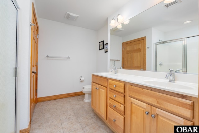 1700 Paget Rd Unit C 3, Kill Devil Hills, NC 27948 - bathroom featuring a shower stall, toilet, tile patterned floors, double vanity, and baseboards