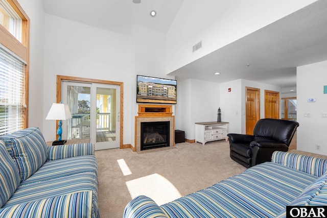 1700 Paget Rd Unit C 3, Kill Devil Hills, NC 27948 - living area with healthy amount of natural light, carpet, a fireplace with flush hearth, baseboards, and a high ceiling