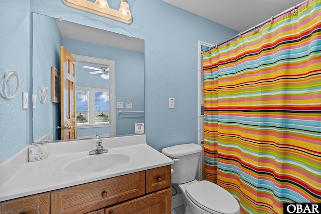 24205 Caribbean Ct Lot 8, Rodanthe, NC 27968 - bathroom with toilet, vanity, a ceiling fan, a shower with shower curtain, and a textured wall