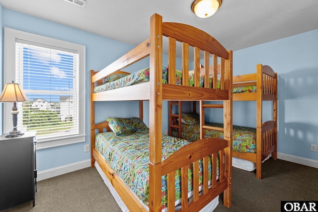24205 Caribbean Ct Lot 8, Rodanthe, NC 27968 - carpeted bedroom featuring baseboards and multiple windows