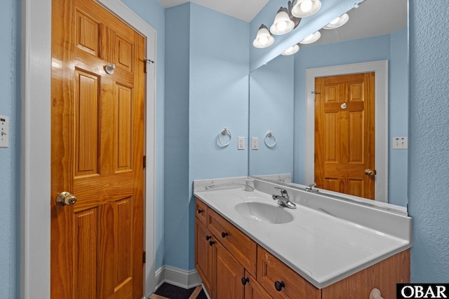 24205 Caribbean Ct Lot 8, Rodanthe, NC 27968 - bathroom featuring a textured wall and vanity