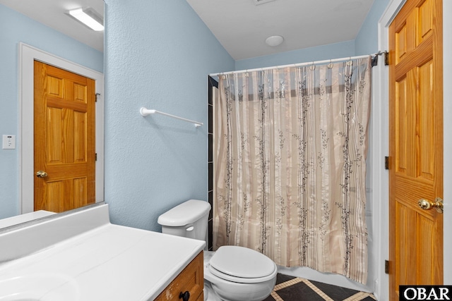24205 Caribbean Ct Lot 8, Rodanthe, NC 27968 - bathroom featuring toilet, a textured wall, and vanity