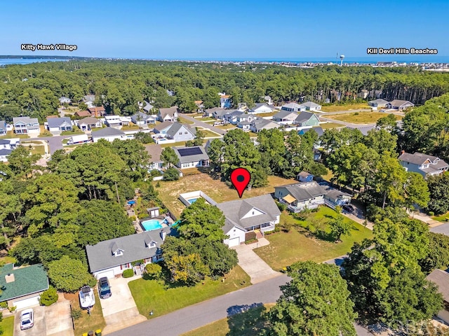 aerial view featuring a residential view and a view of trees