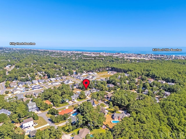 aerial view with a water view, a residential view, and a wooded view