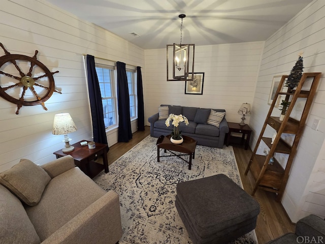 living room with wood finished floors and visible vents