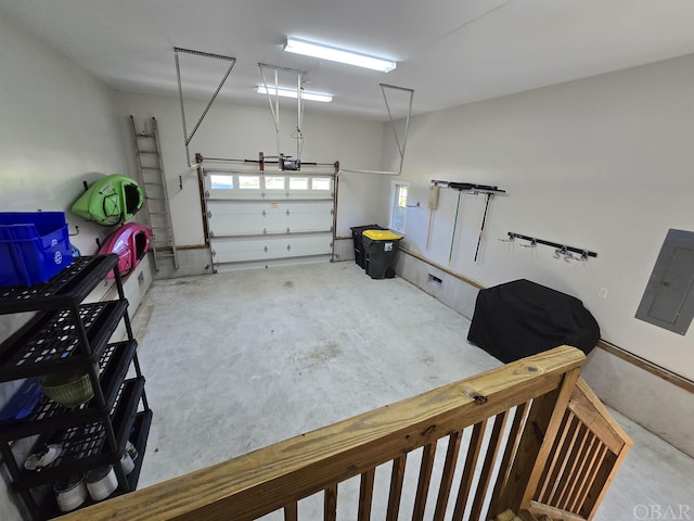 garage with electric panel and a garage door opener