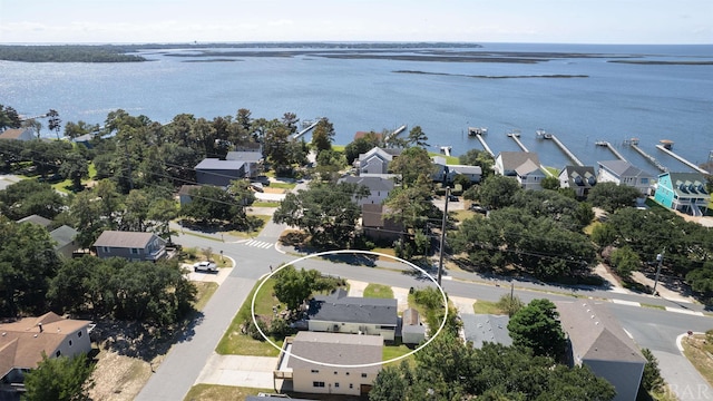 bird's eye view with a water view and a residential view