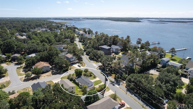 drone / aerial view with a water view and a residential view