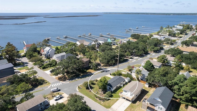 birds eye view of property with a residential view and a water view